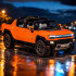 Tālvadības automašīna Hummer EV oranžā krāsā Rastar 93000 1:16