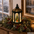 Ziemassvētku dekoratīvā laterna ar LED apgaismotu eglīti un mirdzošām daļiņām, 14 × 6,5 cm